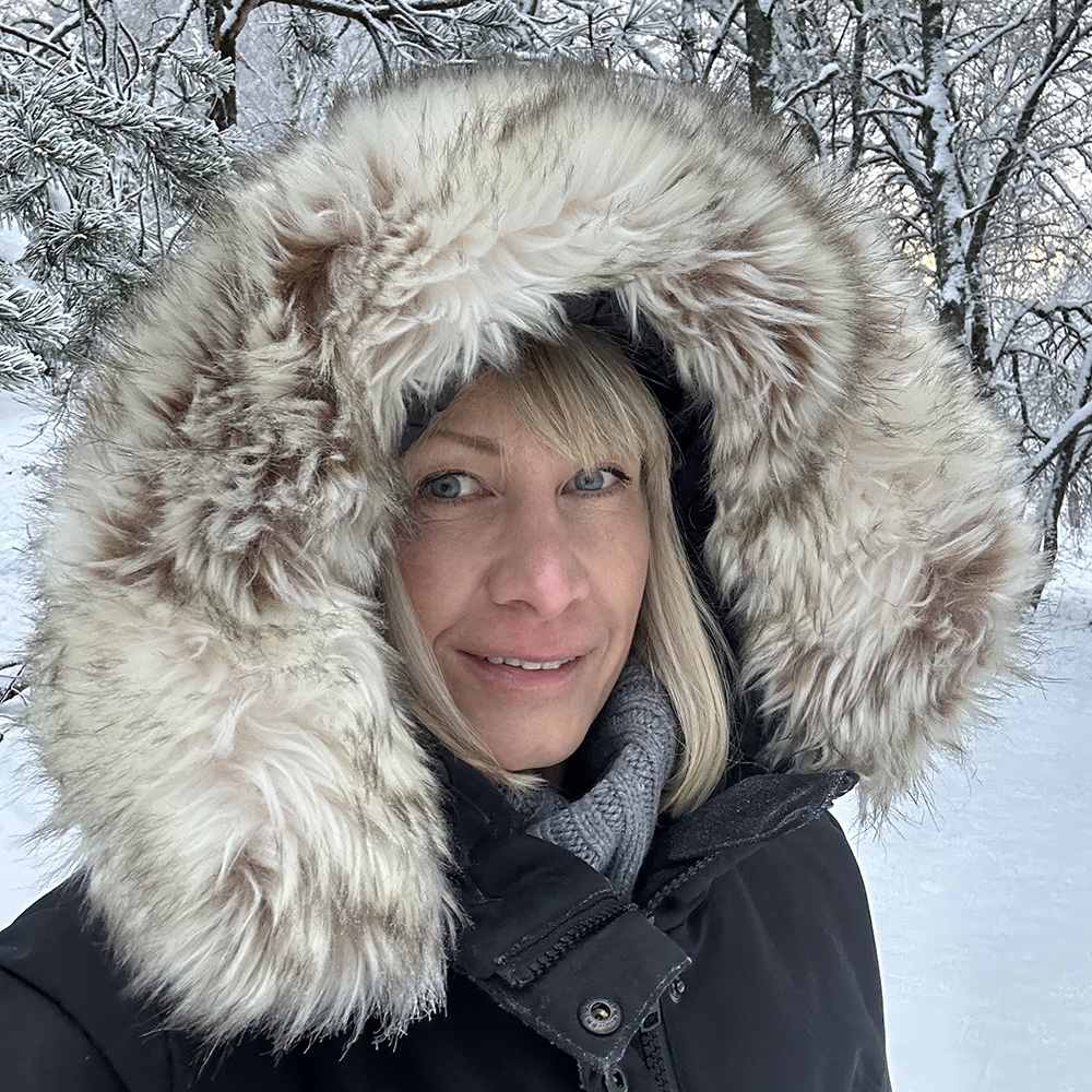 woman in winter coat in the forest